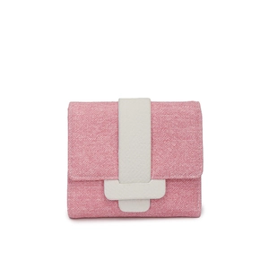 Detail of pink canvas texture wallet with white crossgrain strap and flap closure