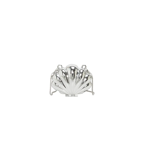 Detailed close-up of a silver shell-shaped mini bag with a mirror-like metallic finish