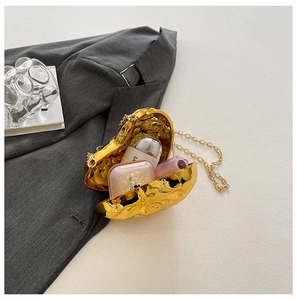 Golden heart-shaped acrylic evening bag with metallic wave texture and chain strap
