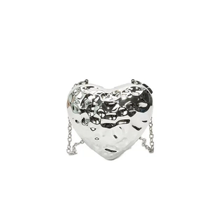 Silver heart shaped acrylic evening bag with hammer texture and metallic chain strap