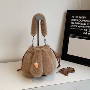Brown plush bucket bag with carrot embroidery and adjustable strap for women