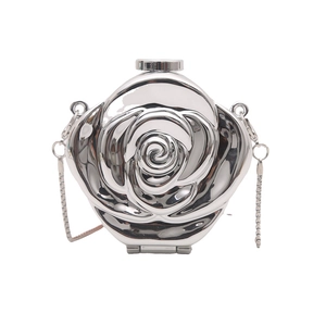 Detailed macro view of silver rose-shaped acrylic clutch bag with metallic finish