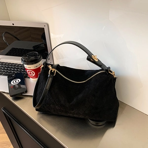 Retro black suede quilted handbag with golden hardware and smooth leather straps