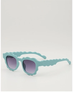 Detailed close-up of mint blue wave-edged kids sunglasses with gradient purple lenses