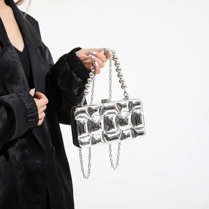 Silver metallic puffer evening clutch with beaded handle and chain strap for women