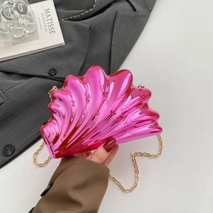 Pink shell acrylic evening clutch bag with golden chain strap and metallic texture