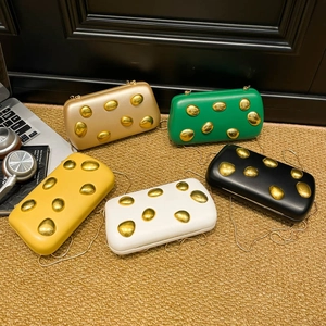 Elegant metallic evening clutch bags in multiple colors with golden pebble decor and chain