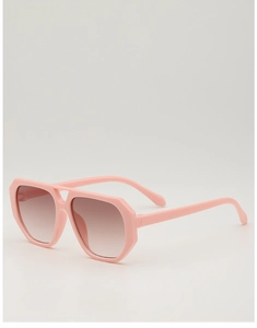 Close-up of pink oversized children's sunglasses with brown gradient lenses