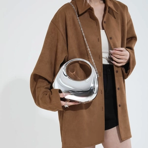 Irregular silver acrylic evening bag with metallic chain strap and mirror finish