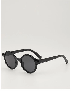 Detail of round scalloped sunglasses frame with textured temples and black finish