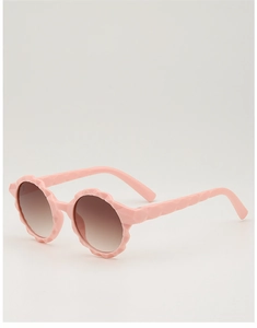 Detail view of pink floral round frame kids sunglasses with gradient brown lenses