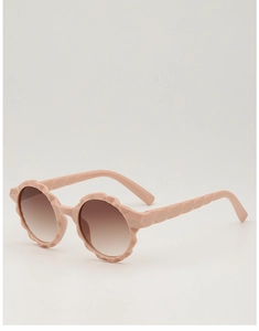 Detailed view of round pink children's sunglasses with geometric textured frames