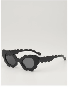 Detail of stylish black kids sunglasses featuring unique wavy frames and temples