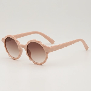 Fashionable round frame pink children's sunglasses with geometric textured edges and gradient lenses