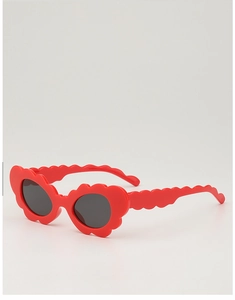 Detail of red scalloped edge kids sunglasses with dark lenses for UV protection