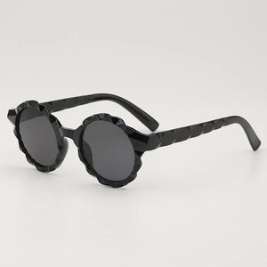 Stylish round frame kids sunglasses with faceted geometric texture and dark grey lenses