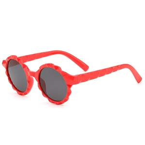Kids round red sunglasses with scalloped wavy frames and dark UV protection lenses