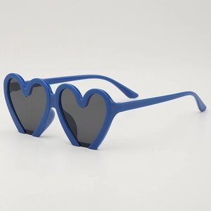 Fashionable heart-shaped kids sunglasses with royal blue frames and dark gray lenses