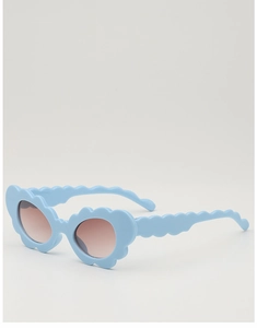 Detail view of light blue wavy frame sunglasses with brown gradient lenses for children