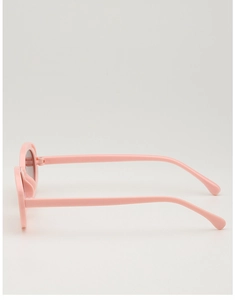 Side view of pink children sunglasses showing streamlined frame design and smooth texture