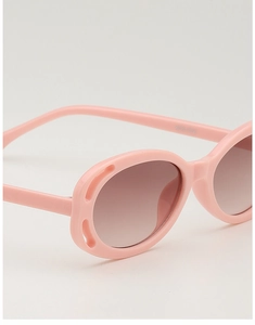 Detail view of pink kids sunglasses with brown gradient lenses and item number KD61078