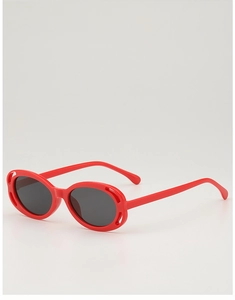 Detail view of red oval children sunglasses with thick frames and dark lenses