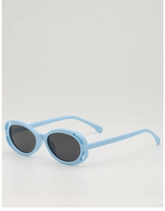 Close-up of light blue hollowed-out children's sunglasses with dark grey oval lenses
