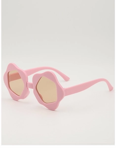 Detailed side view of pink flower-shaped frame kids sunglasses with amber lenses