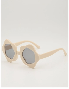 Detailed 45-degree side view of cream flower-shaped kids sunglasses with grey lenses