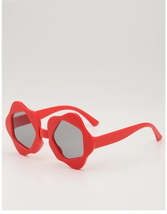 Detail of red flower-shaped kids' sunglasses with grey lenses and plastic frames