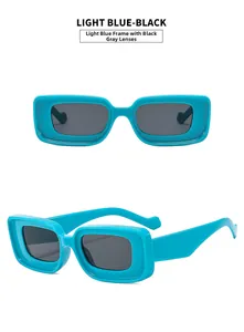 Detail of light blue rectangular sunglasses with black-gray lenses and thick frame