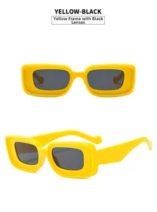Detail view of yellow rectangle frame sunglasses with dark grey lenses in color Yellow-Black