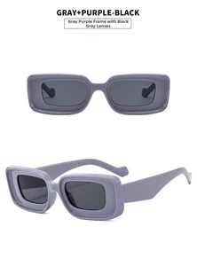 Detail view of gray-purple square sunglasses with thick frames and dark gray resin lenses