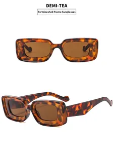 Detail view of Demi-Tea rectangular sunglasses with tortoiseshell pattern and brown lenses
