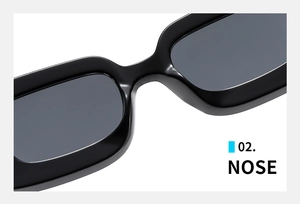 Detail shot showing the ergonomic nose bridge of sleek black rectangular sunglasses