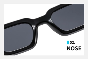 Detailed close-up of integrated nose pads on black retro rectangular thick frame sunglasses