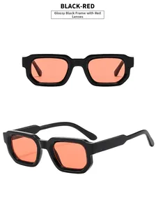 Detail view of retro rectangle sunglasses with bright black frames and red lenses
