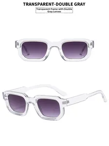 Detail of vintage square sunglasses with thick transparent frames and purple gradient lenses