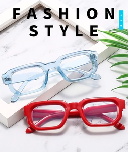 Flat lay of square chunky sunglasses in transparent blue and vibrant red colors