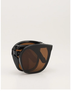 Faltbare schwarze Sonnenbrille mit bernsteinfarbenen Gläsern und Faltmechanismus
