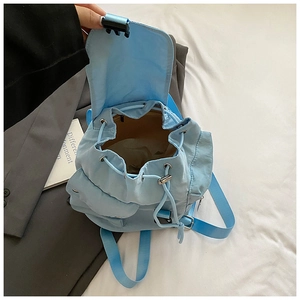 Top view of spacious light blue nylon drawstring backpack interior with flap closure