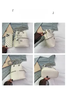 Four-angle view of white quilted bucket bag with pearl bow and silver heart charm