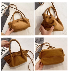 Détails de ce sac cabas en daim marron avec fermoir doré et texture de cuir souple