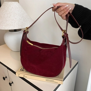 Retro burgundy suede crescent hobo bag with gold zipper and adjustable shoulder strap