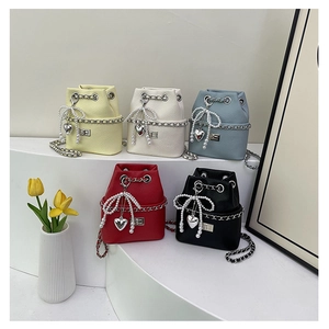 Mini bucket bags with pearl bow charms and chain straps in five assorted colors