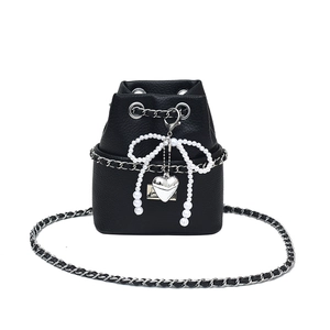 Elegant black lychee grain bucket bag with pearl bow pendant and silver heart charm
