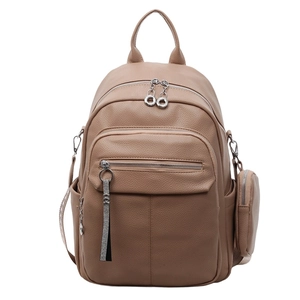 Close-up of soft khaki leather backpack featuring high-quality lychee texture and round zipper