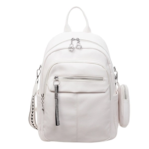 Detail of white lychee leather backpack with round coin purse and silver zippers