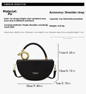 Detail view of black PU saddle bag with gold handle and 25x7x13cm size specifications