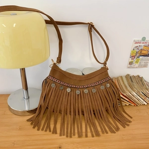 Bohemian brown suede shoulder bag with fringe, ethnic embroidery and metal charms